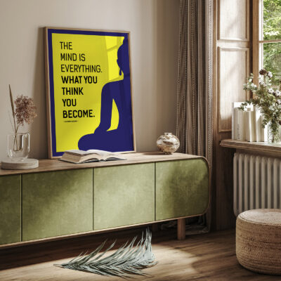 Buddha quote poster placed on green sideboard in cozy room.