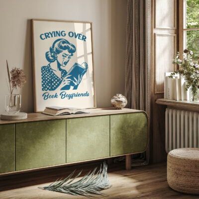 Crying Over Book Boyfriends poster styled in a cozy reading nook.