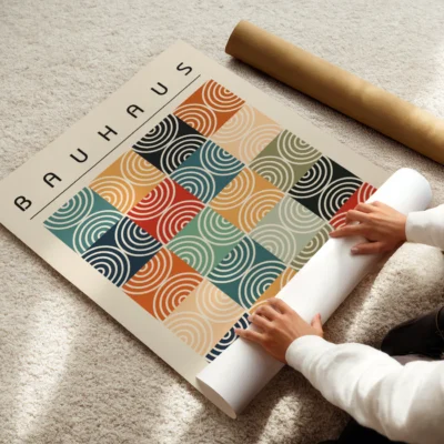 Modern wall art featuring concentric arcs in warm tones on a soft cream background