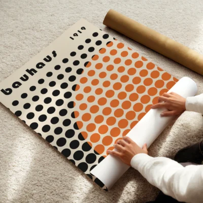 Simple grid of black circles crossed by a bold orange semi-circle in “Solar Mesh”