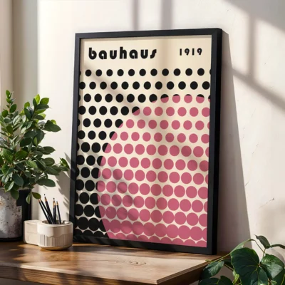 Modern abstract artwork print showing black circles cut by a rosy pink dot arc