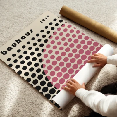 Geometric art poster with playful pink and black dot design on cream paper