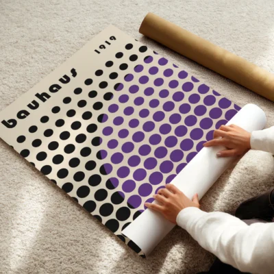 Bauhaus poster showing a grid of black circles cut by purple dots