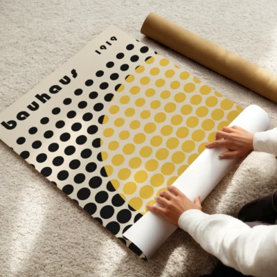 Modern wall decor featuring black dots and a bright yellow curve for “Solar Mesh”
