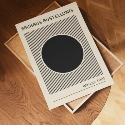 Minimalist circle and line design in black on a cream poster