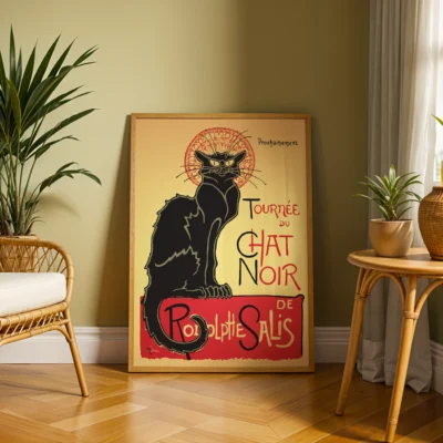 Vintage poster of Tournée du Chat Noir featuring a black cat with a halo, displayed in a living room