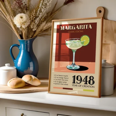 A vintage poster of a Margarita cocktail with a blue pitcher and baked rolls in the background.