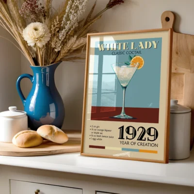 Vintage poster of the White Lady cocktail recipe displayed in a cozy kitchen setting.