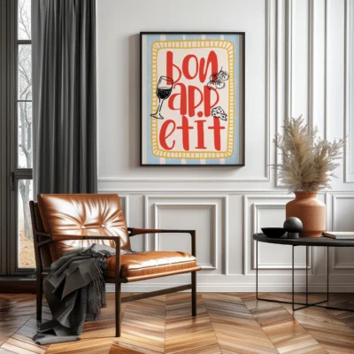 A cozy living room with 'Bon Appétit' print framed on the wall, a brown leather chair, and a potted plant.