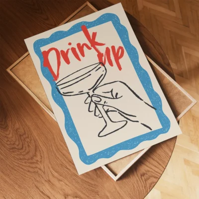 A hand holding a cocktail glass with the text 'Drink up' in red, surrounded by a blue border.