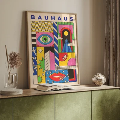 Bauhaus inspired colorful geometric artwork framed and displayed on a table in a modern interior.