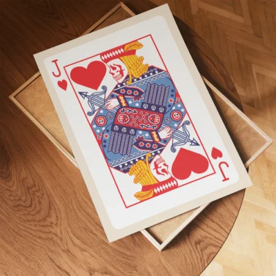 Jack of Hearts playing card on a wooden table and a decorative box