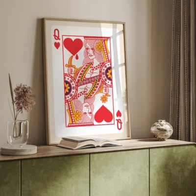 Framed artwork of the Queen of Hearts playing card, displayed in a stylish interior setting.