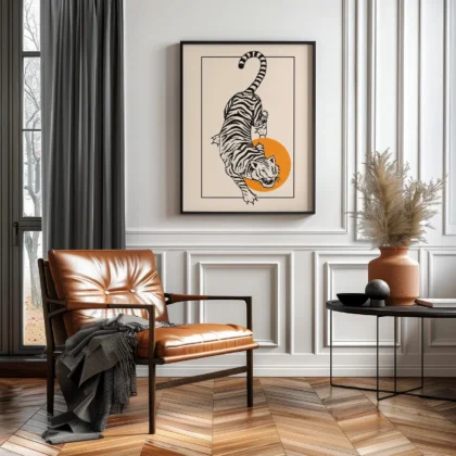 A modern living room with a leather chair, framed tiger artwork, and a side table decorated with a vase and decorative items.