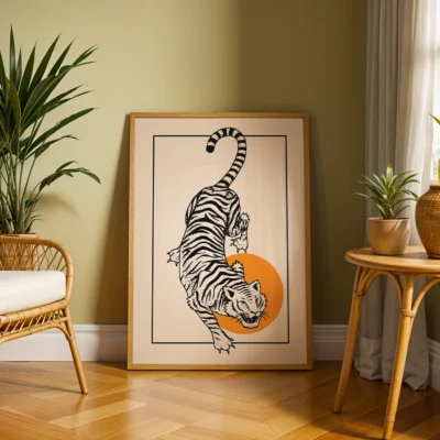Framed artwork of a tiger jumping with an orange ball in a modern living space with plants