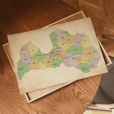 A colorful map of Latvia showing regions and roads on a wooden table