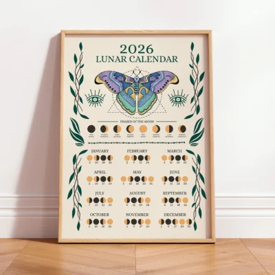 Framed moon calendar poster for 2026 with butterfly and moon phase illustrations in earthy tones.
