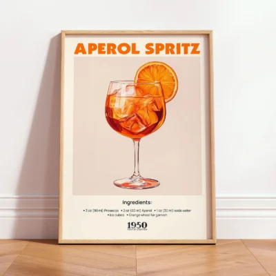 Framed Aperol Spritz vintage cocktail print leaning against wall in minimalist interior.