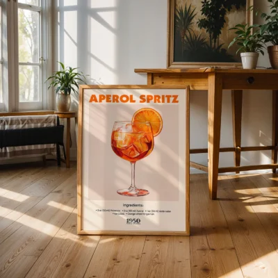 Large Aperol Spritz vintage poster leaning against wall in sunlit room, retro cocktail design.