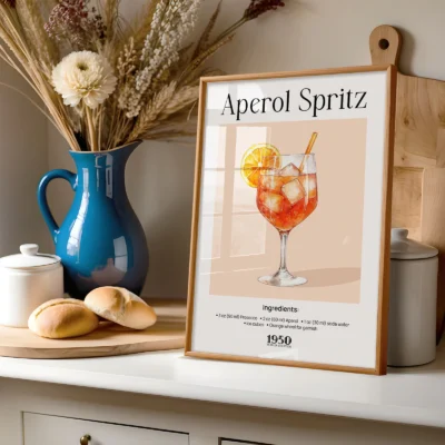 Aperol Spritz vintage cocktail poster on shelf with vase and kitchen decor, warm retro styling.