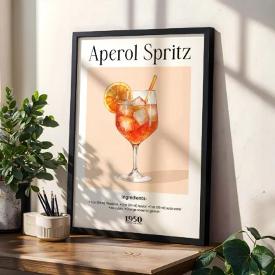 Framed Aperol Spritz cocktail poster on shelf with plants, classic retro bar style.