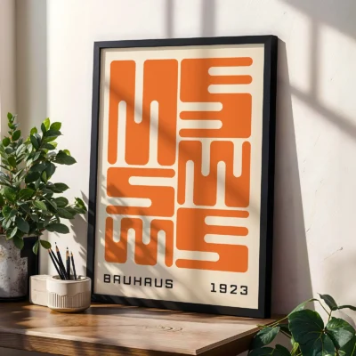 Bauhaus original poster leaning on table, orange wave typography in geometric Bauhaus style.