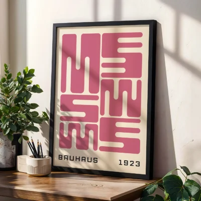 Bauhaus original poster leaning on table, pink wave typography in geometric Bauhaus style.