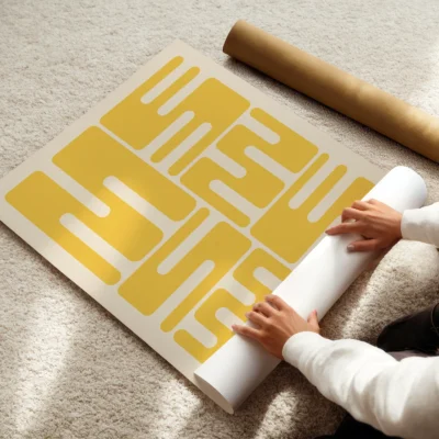 Bauhaus original poster print being rolled, yellow wave typography in minimalist Bauhaus 1923 style.