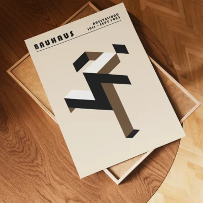 Art print Bauhaus running man poster flat lay on wooden floor, brown geometric Bauhaus composition.