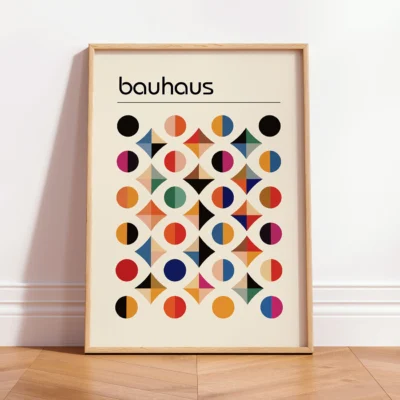 Bauhaus geometric poster leaning against white wall with wood frame