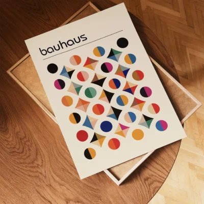 Unframed Bauhaus poster laid flat on wooden surface
