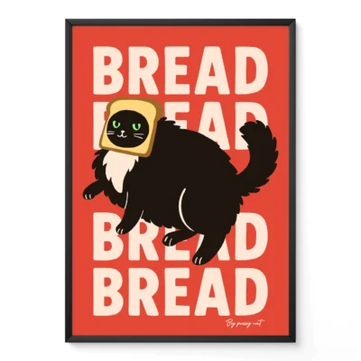 Framed poster of black cat with toast on head and repeated "BREAD" text