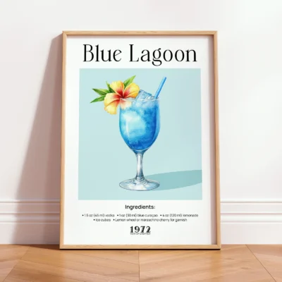 Framed Blue Lagoon vintage cocktail print leaning against wall in a minimalist interior.