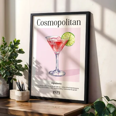 Framed Cosmopolitan cocktail poster on shelf with plants, elegant vintage bar style.