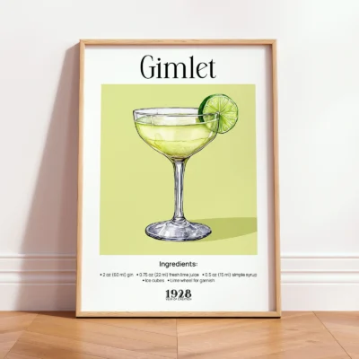 Framed cocktail wall print leaning against wall in bright kitchen interior.