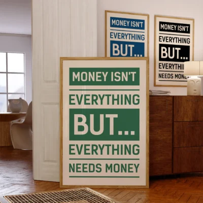 Two framed money quote posters in office setup, blue and green versions side-by-side.