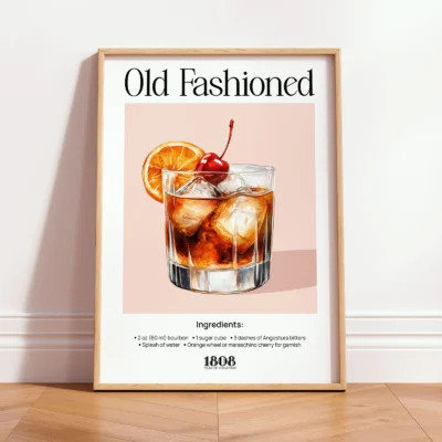 Framed Old Fashioned vintage cocktail print leaning against wall in minimalist interior.