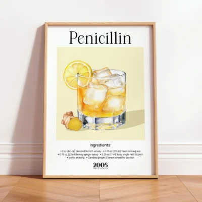 Framed Penicillin vintage cocktail print leaning against wall in a minimalist interior.