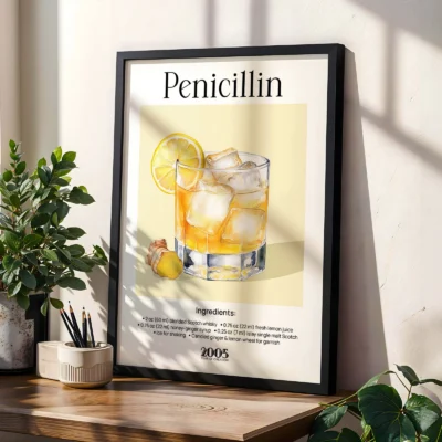 Framed Penicillin cocktail poster on shelf with plants, classic vintage bar style.