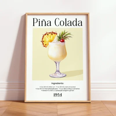 Pina Colada poster in wooden frame, vintage tropical cocktail wall art with soft yellow tones.