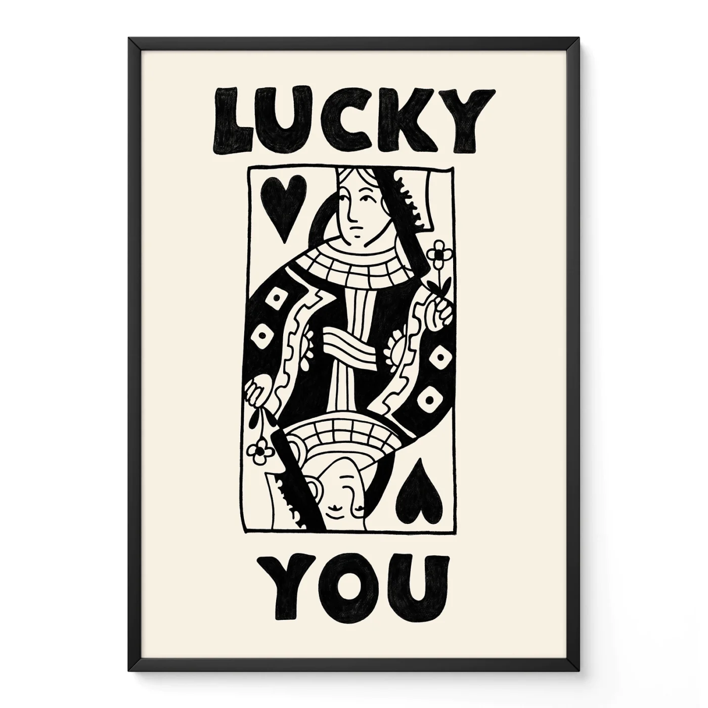Framed black and cream Queen of Hearts poster leaning against wall, hand-drawn retro playing card style.