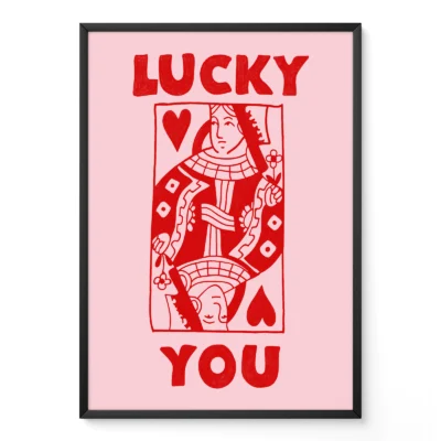 Framed red and pink Queen of Hearts poster leaning against wall, hand-drawn funky retro playing card style.