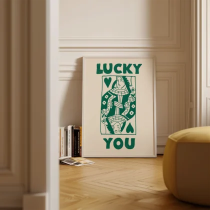 Green and cream Queen card poster standing on floor in minimalist interior, retro playing card design.