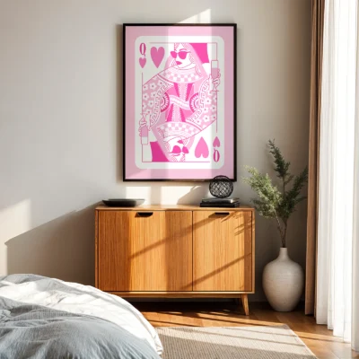 Pink and white Queen of Hearts wall art above wooden cabinet in mid-century modern bedroom.