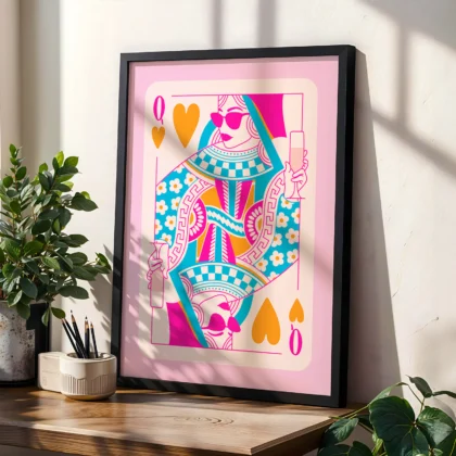 Colorful Queen of Hearts poster in black frame, styled on shelf with plants in a modern interior.