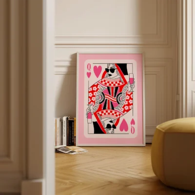 Pink and red Queen of Hearts playing card poster standing on floor in a minimalist room, retro style.