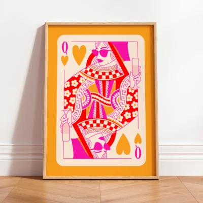 Orange and pink Queen of Hearts art print in light frame, leaning against wall in minimalist interior.