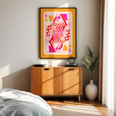 Orange and pink Queen of Hearts wall art above wooden cabinet in mid-century modern bedroom.