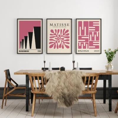 Set of pink minimalist Bauhaus prints in a stylish dining room