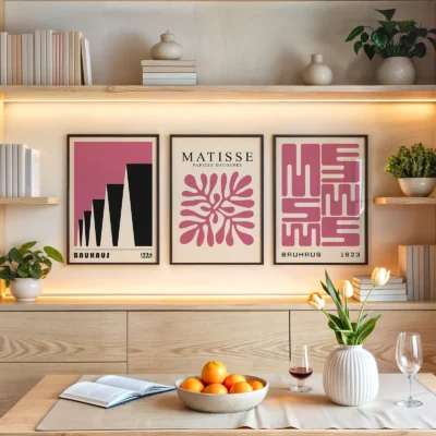 Pink Bauhaus poster trio above shelf with warm natural decor